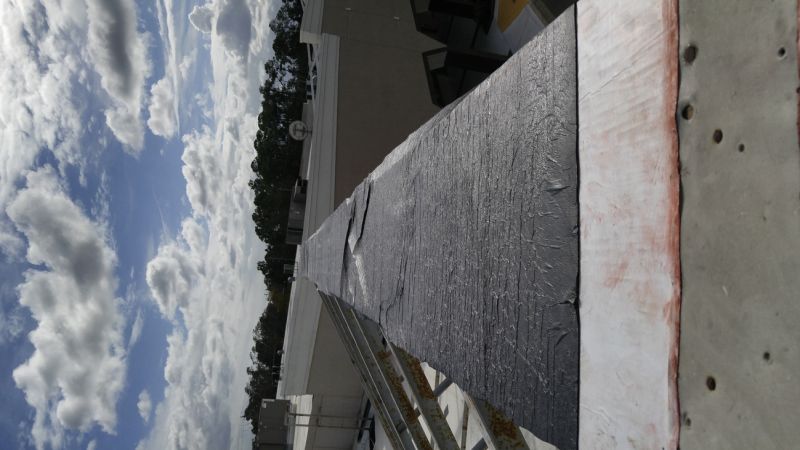 Flat Roof Repair After Storm Or Wind Damage